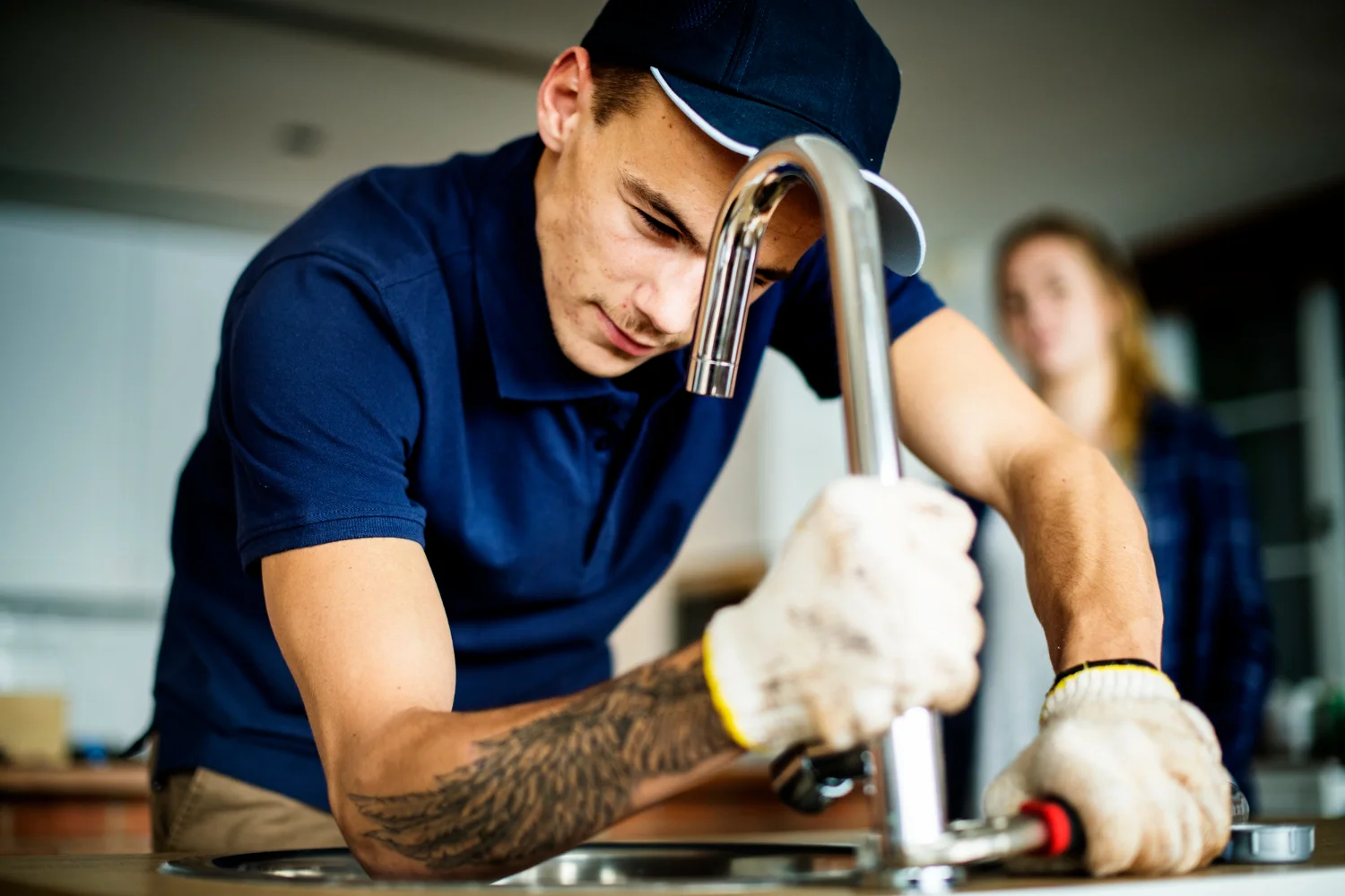 plumber-fixing-kitchen-sink-2025-02-10-09-12-33-utc-scaled